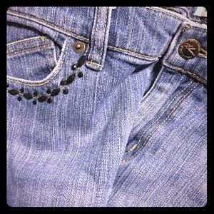 White House jeans with embellishments